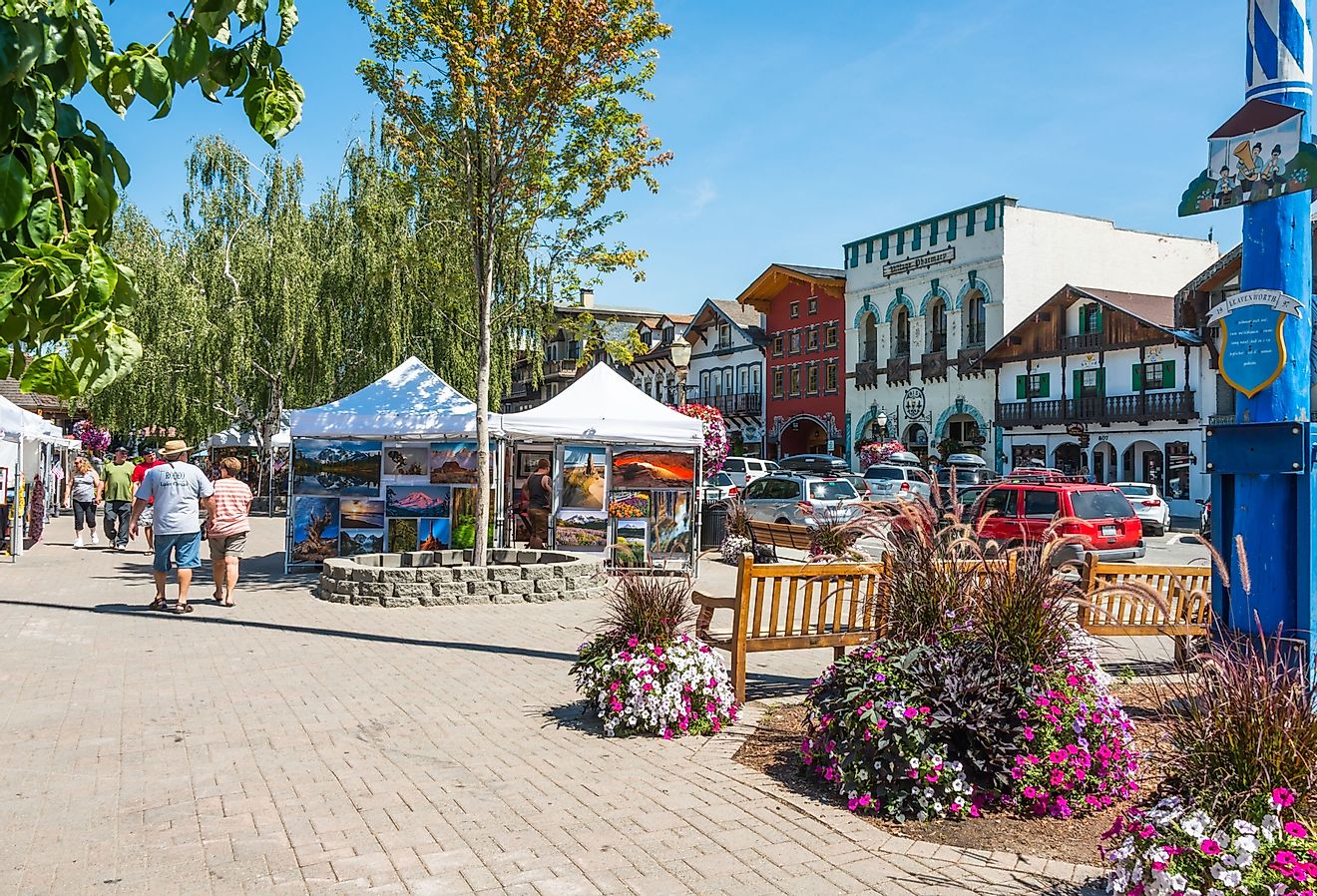 Main tourist street with art show and Bavarian style buildings in Leavenworth, Washington. Image credit Denise Lett via Shutterstock
