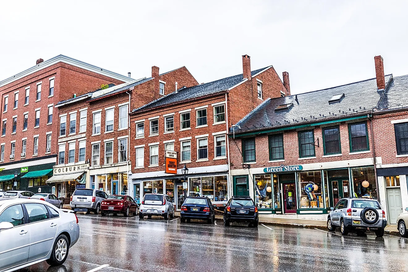 Brick buildings lined along the steep main street in Belfast, Maine. Image credit Kristi Blokhin via Shutterstock