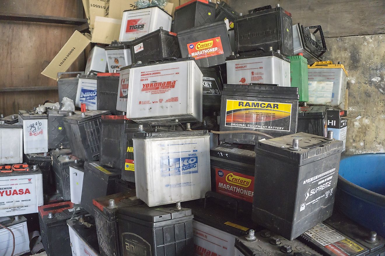 A pallet holds several batteries awaiting recycling at a metal recycling scrap yard. Image credit: Iamcontributor/Shutterstock.com