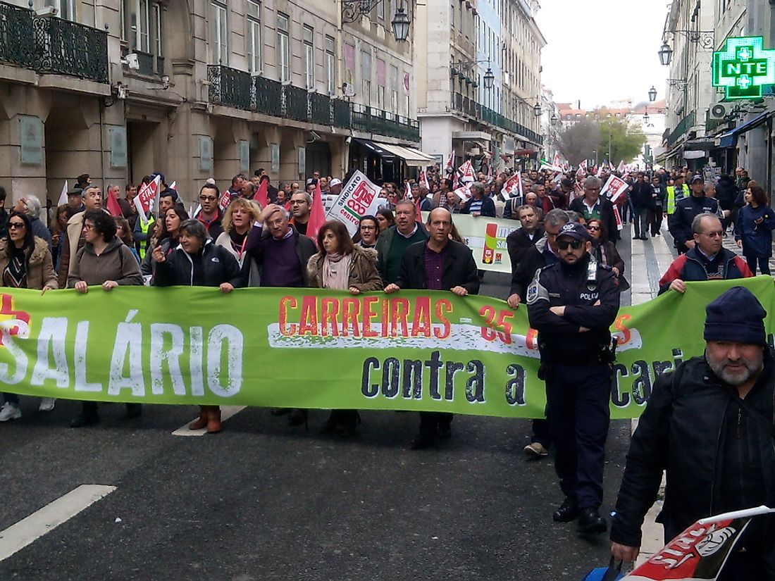 A march for workers' rights in Lisbon, Portugal. Editorial credit: Pedro Louro / Shutterstock.com. 