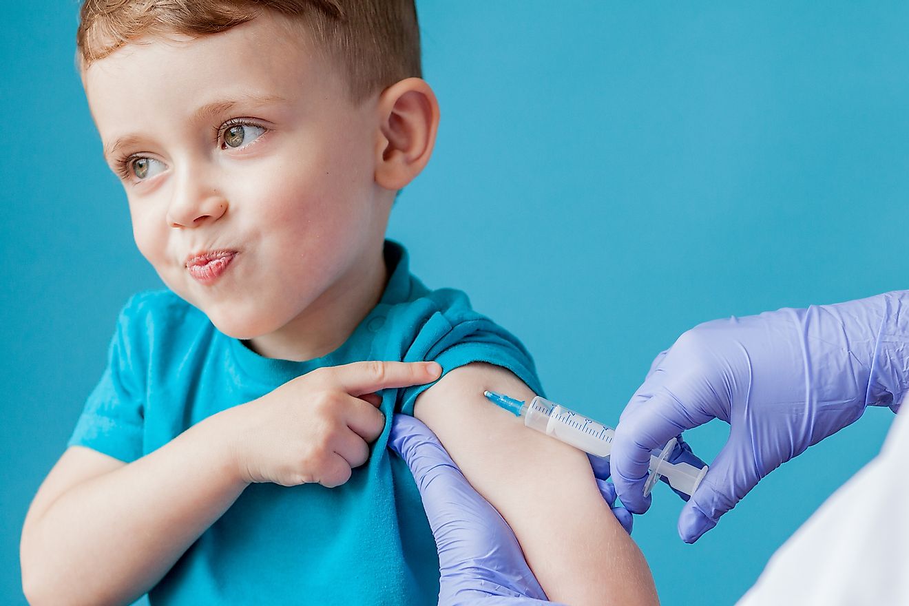 A young boy receiving vaccination. Image credit: Volodymyr Maksymchuk/Shutterstock.com