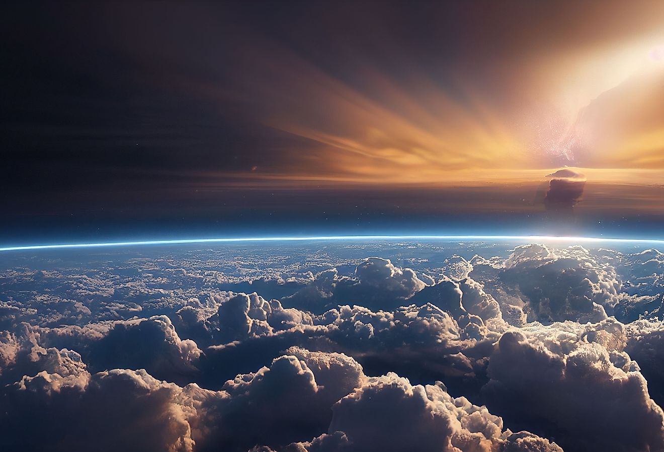 Splendid background cloudscape above the earth's atmosphere in the stratosphere, with a galaxy and black, starry space at the horizon. of view from above the space.
