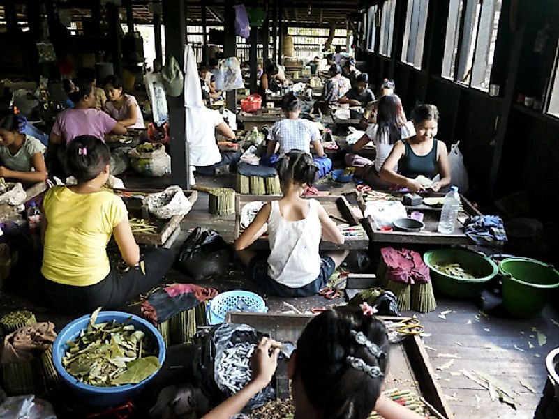 Young children in Myanmar working long hours in poor conditions for low wages with little to no government regulation.