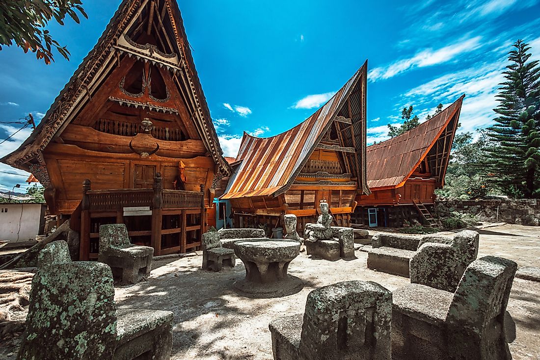 Traditional Batak houses on Samosir island, Indonesia. Editorial credit: akedesign / Shutterstock.com