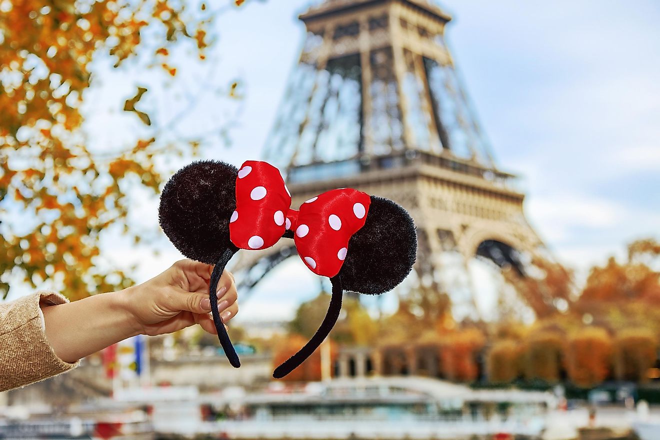 Minnie Mouse ears in front of the Eiffel Tower.