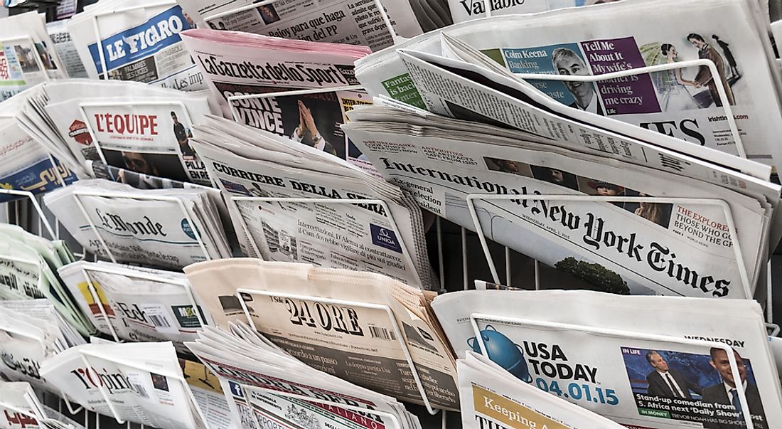 Newspapers being sold in various languages in New York City. Editorial credit: Lawrey / Shutterstock.com. 