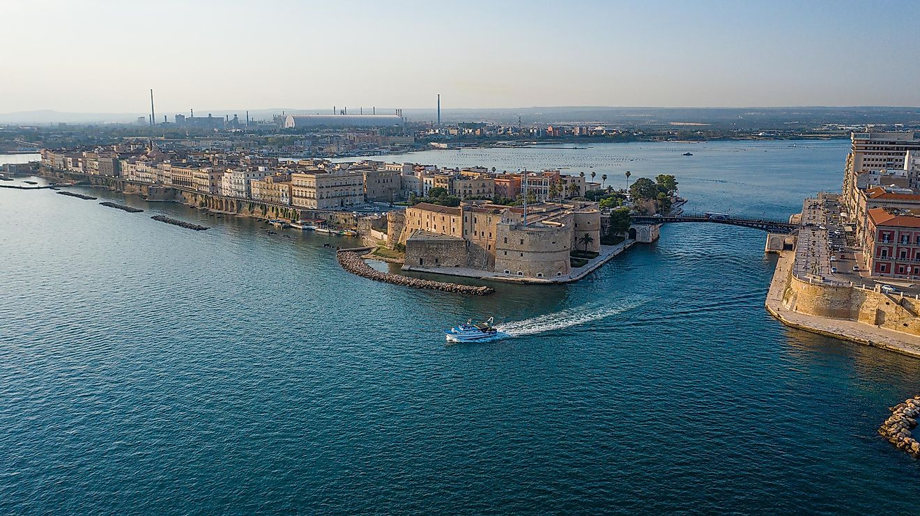 The Gulf Of Taranto with the Old medieval Aragonese Castle on sea channel.