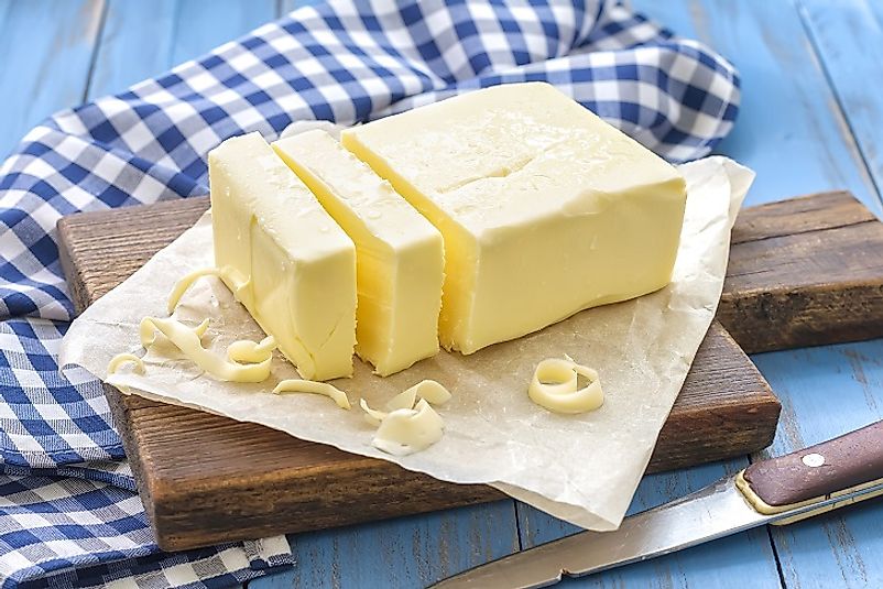 Cream separated from milk is churned and shaped into blocks of butter. Butter has a wide variety of culinary applications.