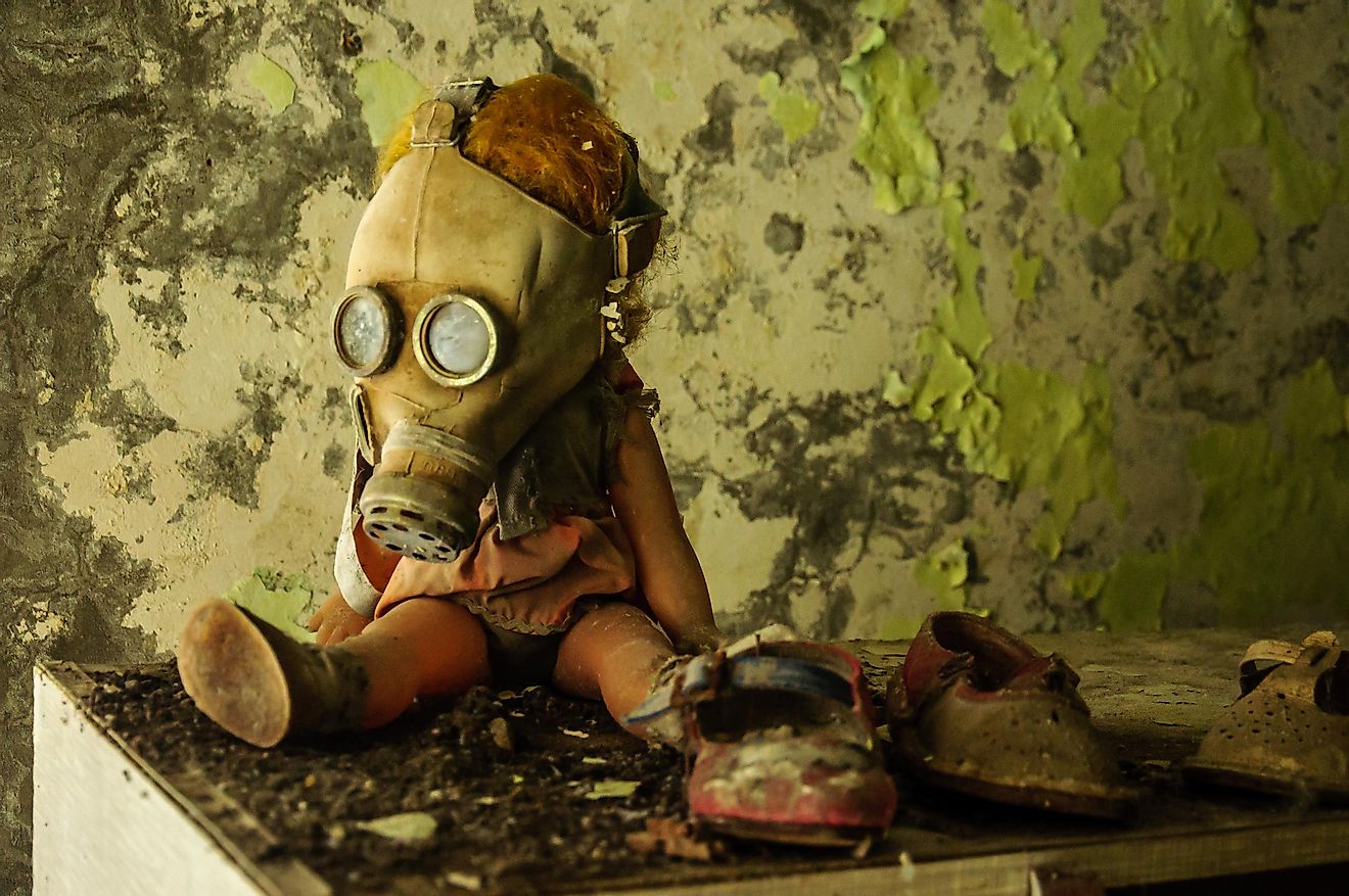 Chernobyl, Ukraine, February 2016 - A doll in a gas mask in abandoned city of Pripyat. Credit: Ondrej Bucek / Shutterstock.com