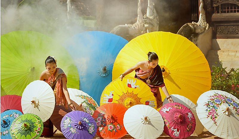 Women wearing traditional Thai dresses in Thailand. 