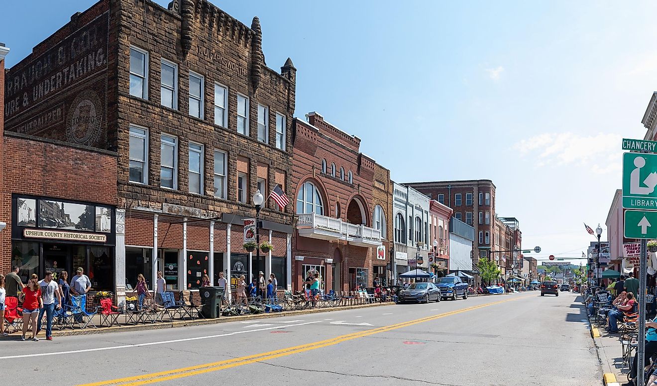 Buckhannon, West Virginia, USA - May 18, 2019: The Historic Building along Main Street, with locals and tourist walking along, waiting for the parade