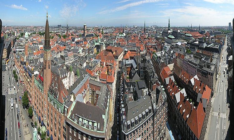 The city skyline of Copenhagen features many towers and spires.