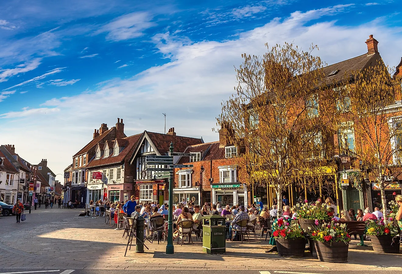 Street cafe with people eating at outdoor tables in the Historic Town Center of Beverley, East Riding of Yorkshire, England. Image credit Sergii Figurnyi via Shutterstock