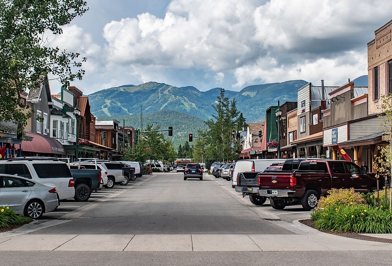 Main Street view of Whitefish, Montana with mountains in the background. Image credit Beeldtype via Shutterstock.