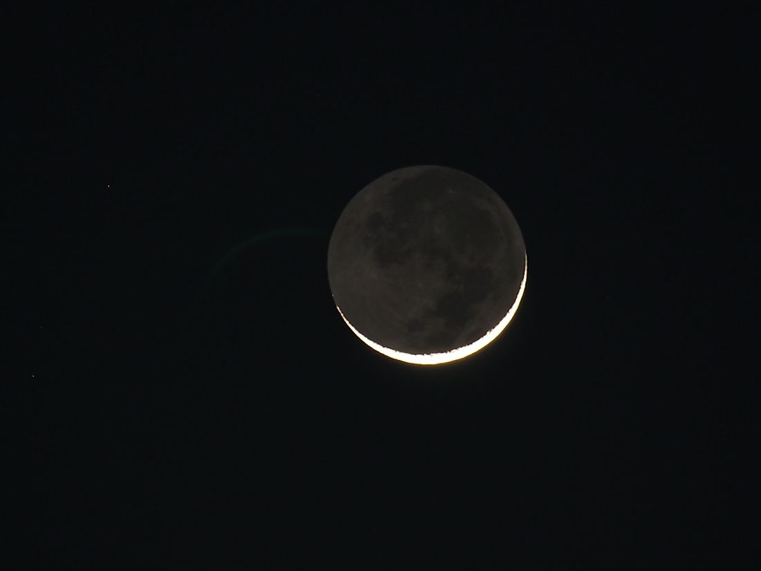 Earthshine blankets the dark side of the moon in a gentle glow. 