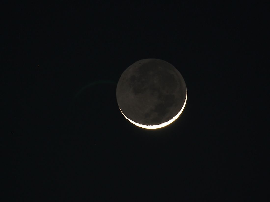 Earthshine blankets the dark side of the moon in a gentle glow. 