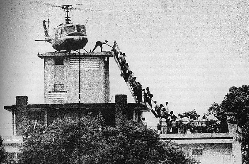 A CIA helicopter carrying away evacuees during the Fall Of Saigon to the communist forces.
