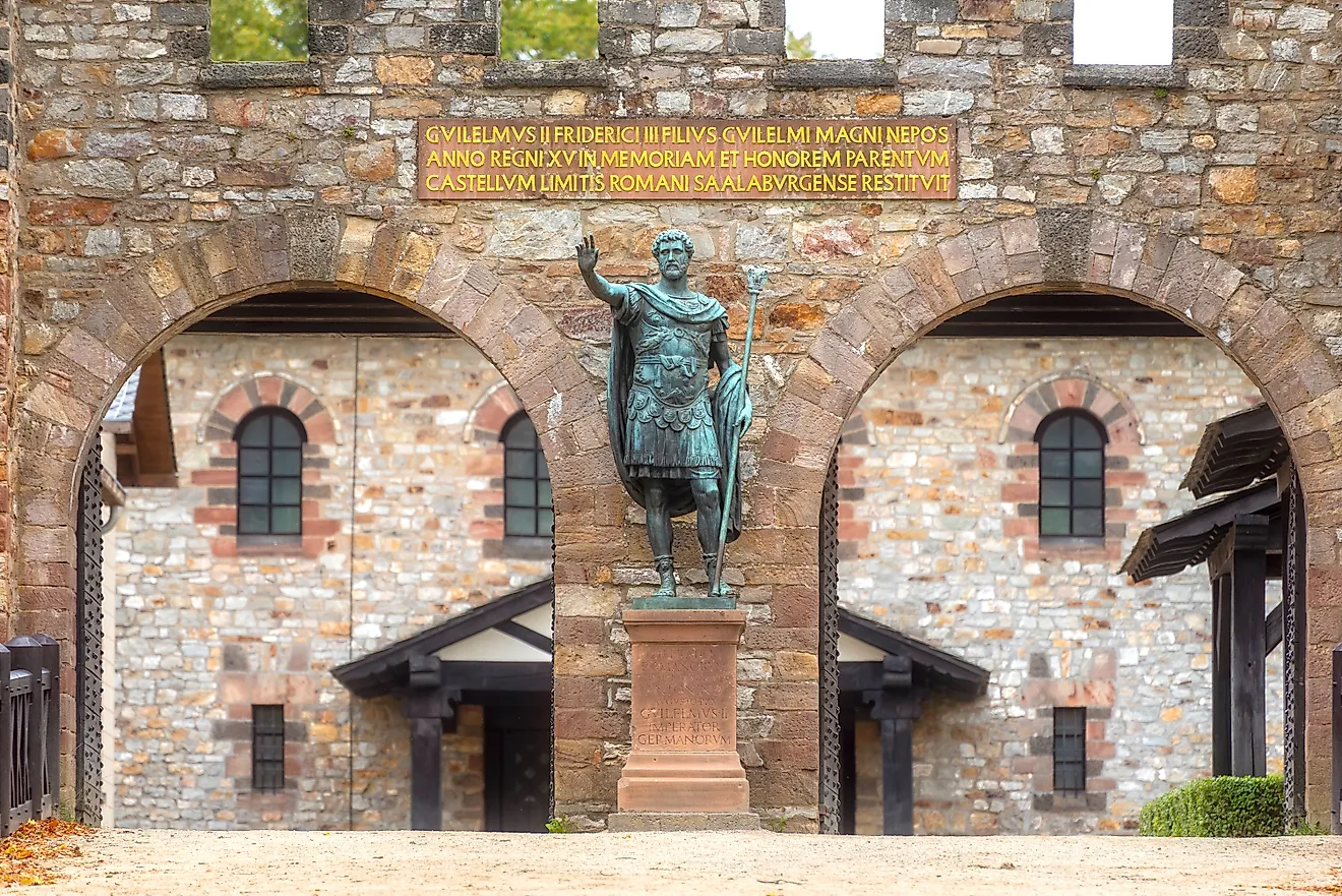 A restored Roman fort on the Limes in the Taunus mountains, Hesse, Germany, with a statue of Emperor Antonius Pius. Image credit: Frank Wagner / Shutterstock.com.