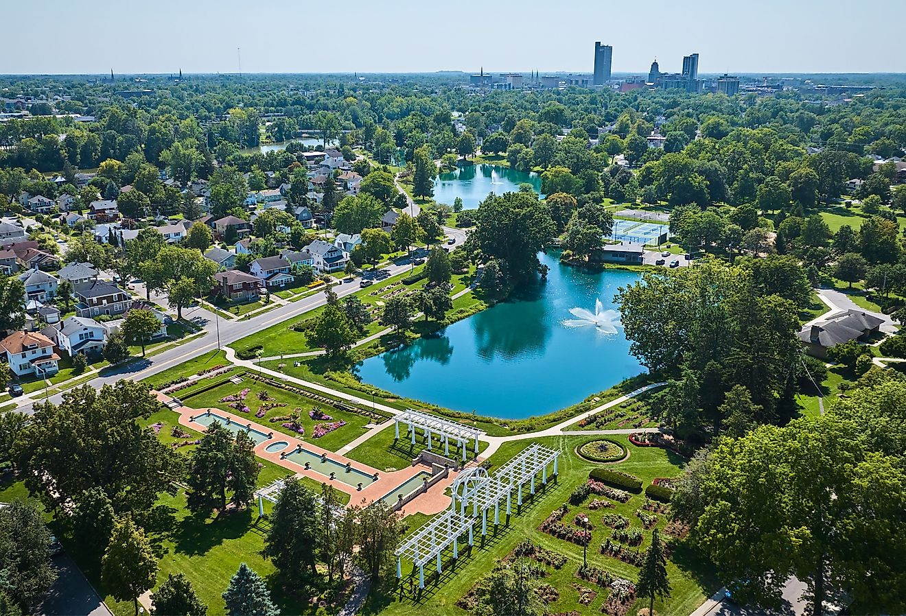 Aerial Lakeside Park gardens and fountains with distant downtown Fort Wayne.