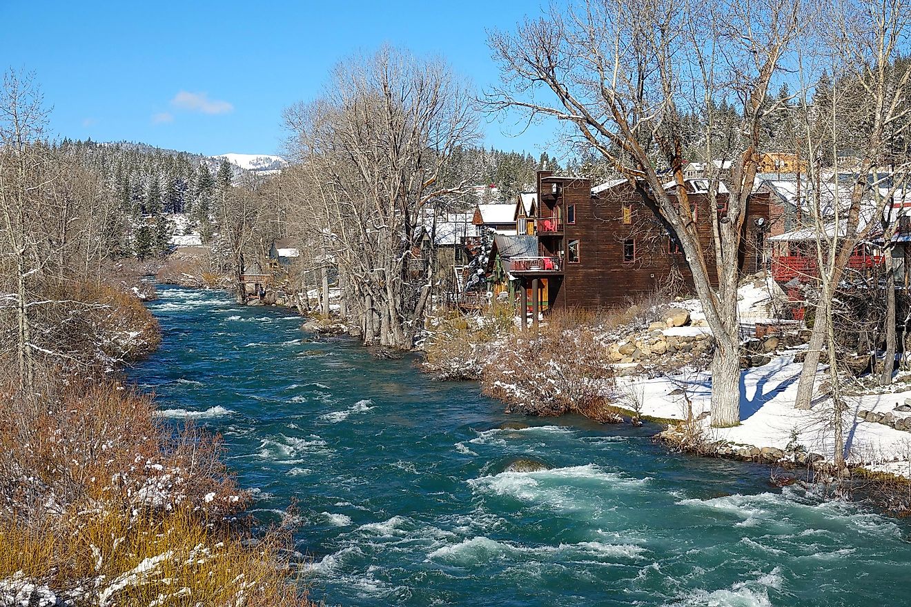 The beautiful Emerald River flowing past old wooden houses in scenic Truckee, California.