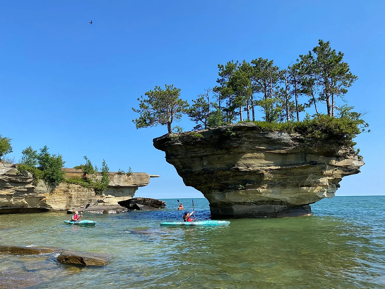 Paddlers reach the iconic Turnip Rock at the top of Michigan’s Thumbcoast. Image Credit: Andrew Douglas