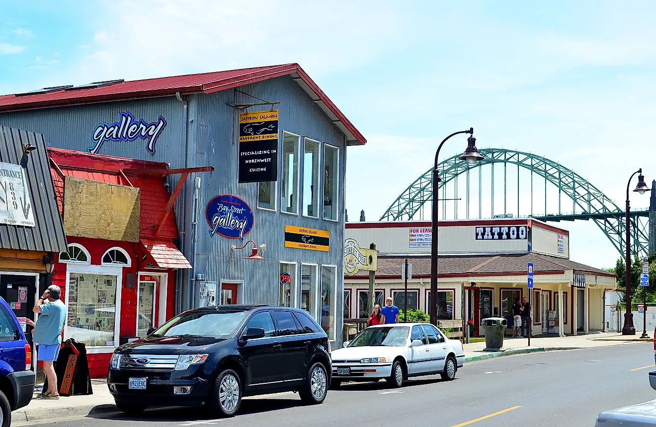Front street view of Newport fishing town with Yaquina Bay bridge at the background, Oregon. 