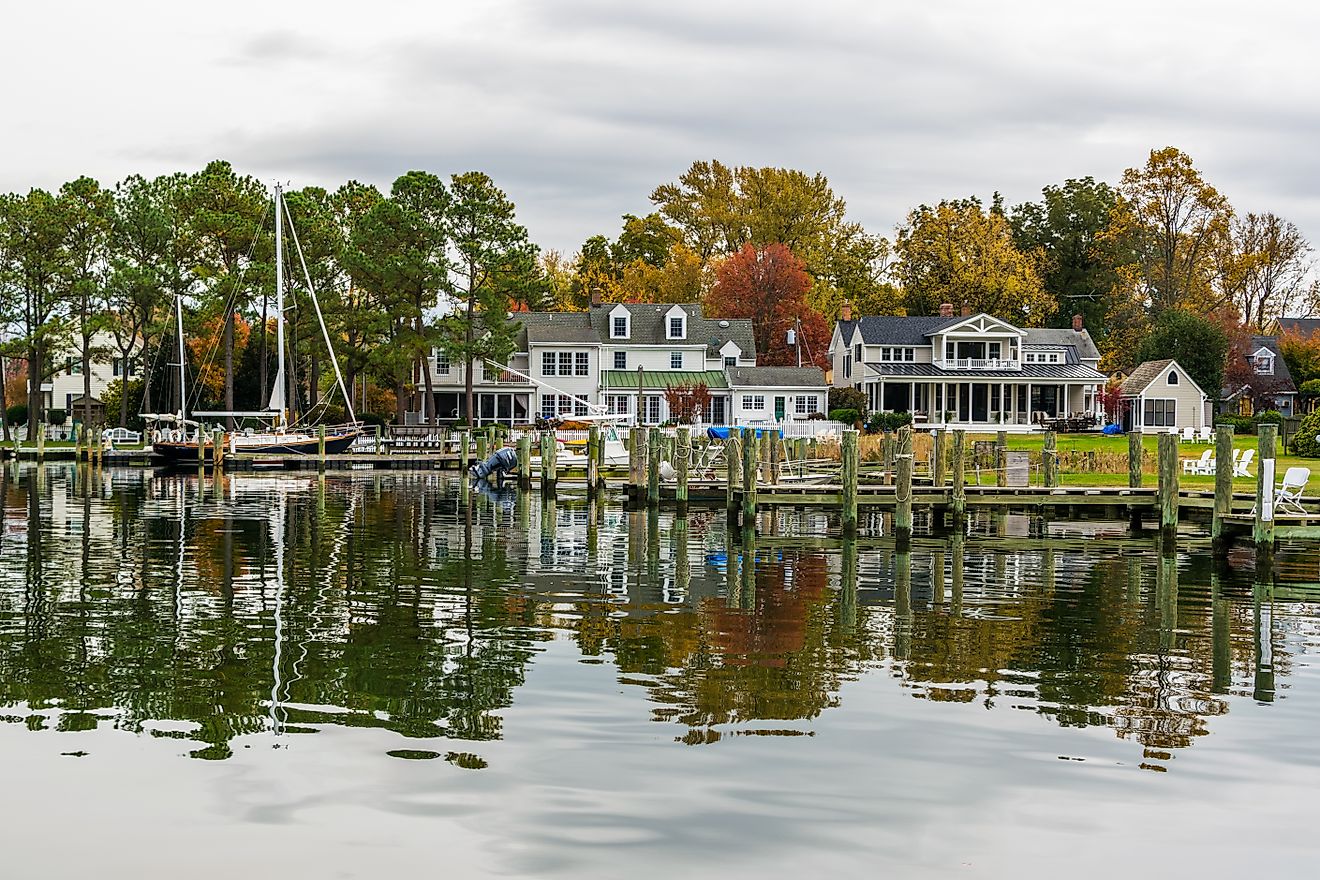 Waterfront homes and a boat docked along the harbor in St. Michaels, Maryland.