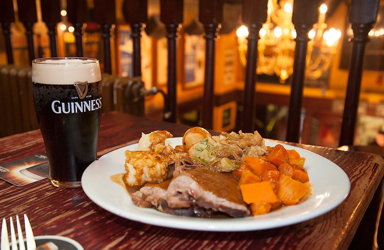 A hearty Irish dinner with beer in a traditional Irish pub. Image credit: Sharkshock/Shutterstock.com