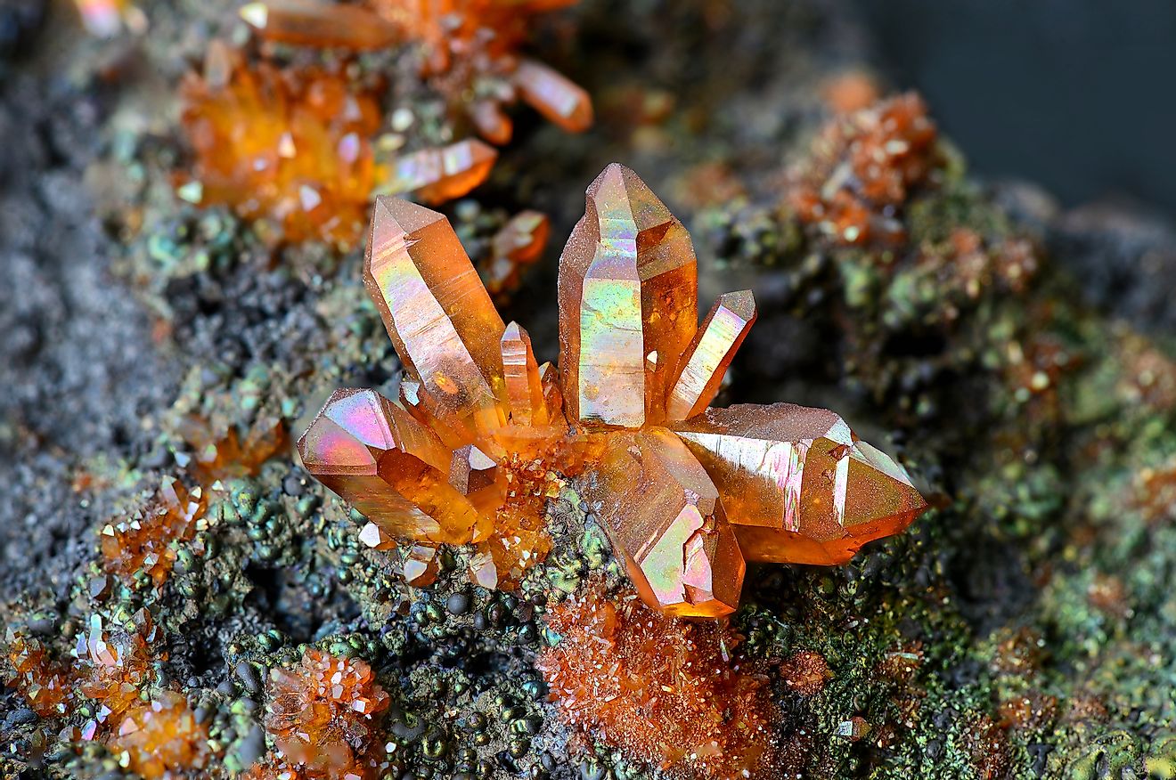 Quartz crystals coated with iridescent limonite from Banska Stiavnica, Slovakia. Image credit: Albert Russ/Shutterstock.com