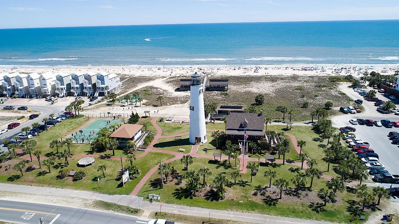 The beautiful coastline with beachside homes and a lighthouse at St. George Island.