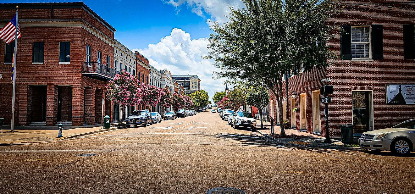 The Main Street lined with brick buildings in Natchez, Mississippi. Editorial credit: VioletSkyAdventures / Shutterstock.com
