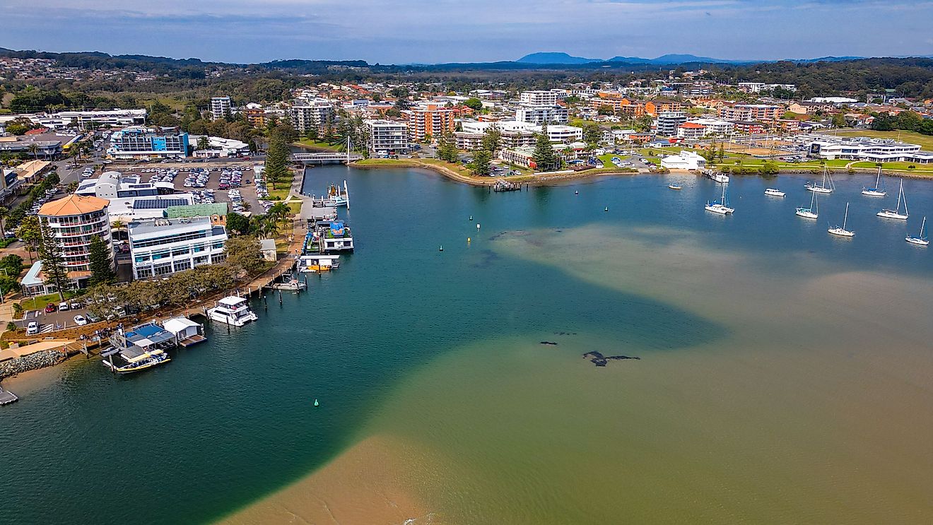 A view of Port Macquarie in NSW surrounded by modern buildings and ships.