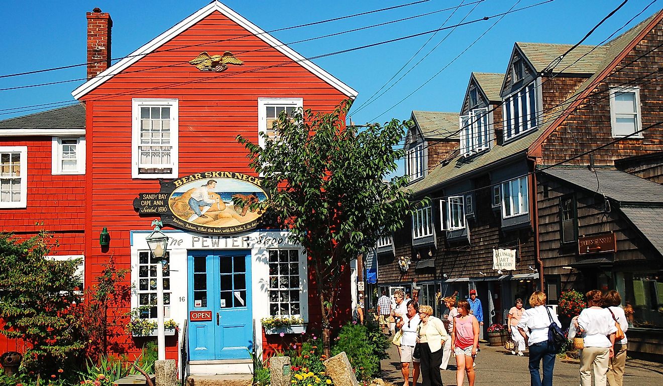 Folks stroll around the unique shops and boutiques on Bearskin Neck in Rockport, Massachusetts. Editorial credit: James Kirkikis / Shutterstock.com