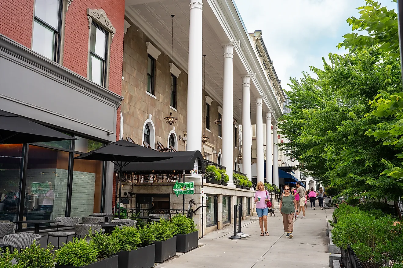 Street scene from historic Saratoga Springs, New York with historic architecture and people in view. Editorial credit: Little Vignettes Photo / Shutterstock.com