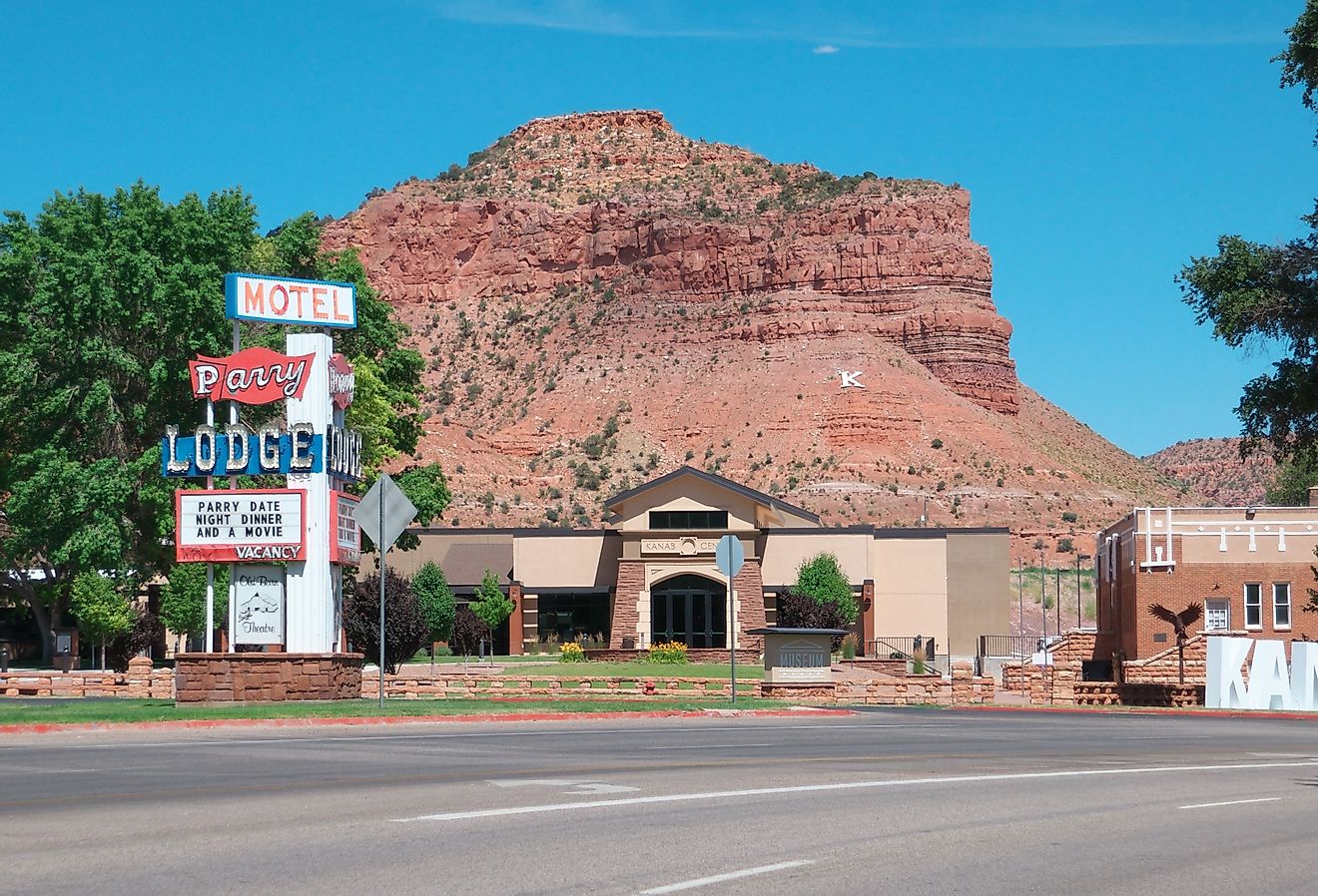 Parry lodge sign, the mountain and Kanab sign in Kanab, Utah. Image credit Christophe KLEBERT via Shutterstock