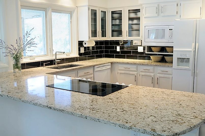 The beautiful granite countertops serve as the centerpiece of this kitchen.