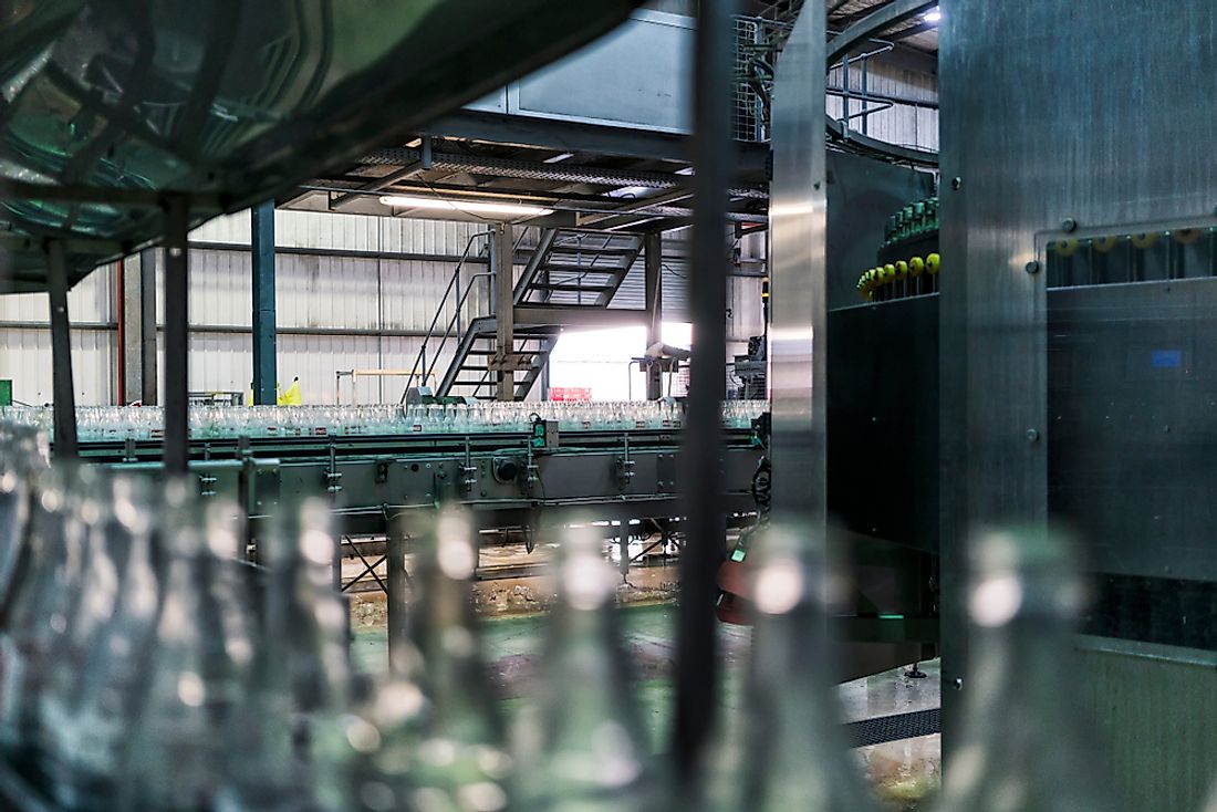 The assembly line of a coca cola factory location in Angola. Editorial credit: Andre Silva Pinto / Shutterstock.com.