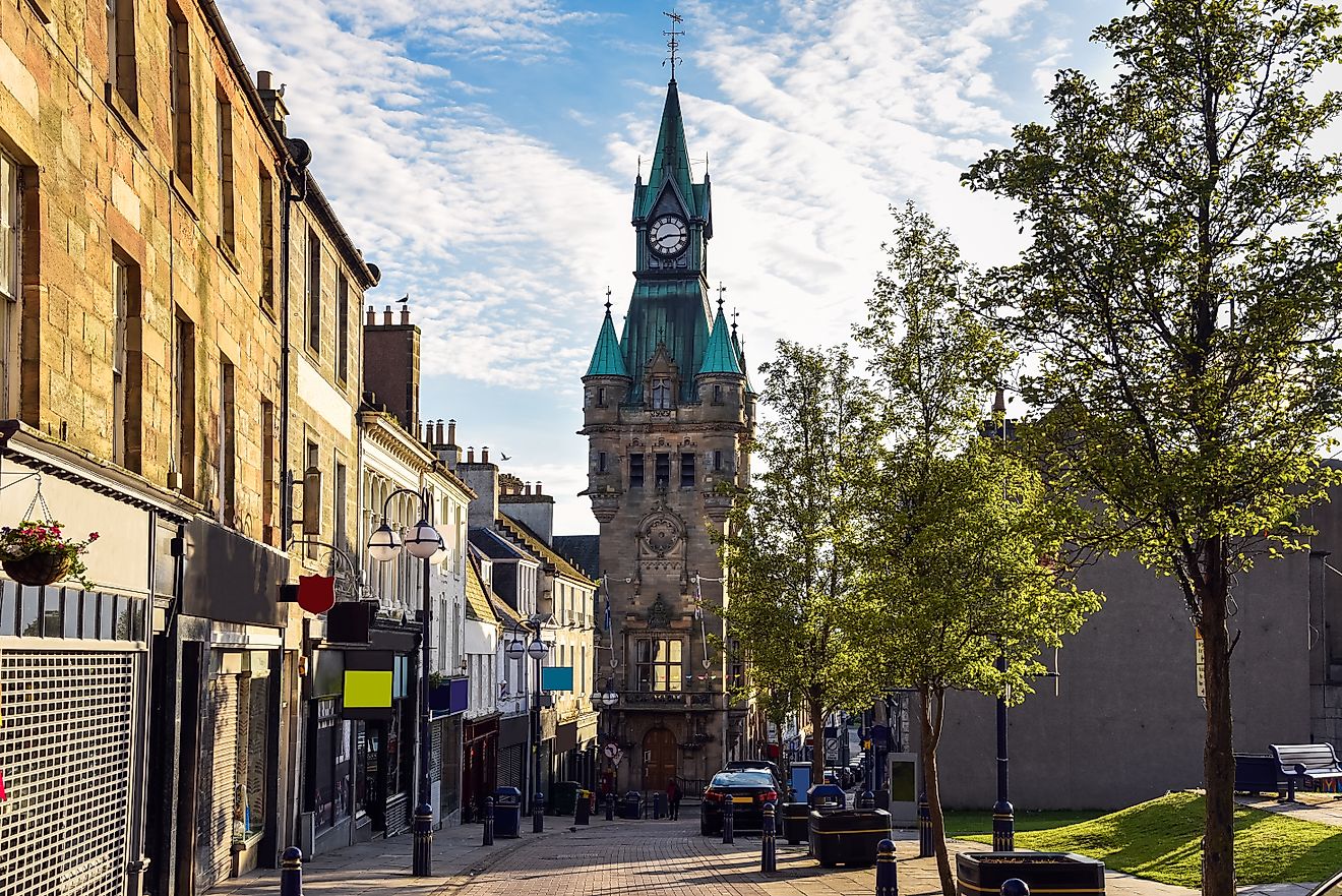 Traditional architecture with shops and restaurants along a pedestrian street in a town centre at sunset. Dunfermline, Fife, Scotland, UK.
