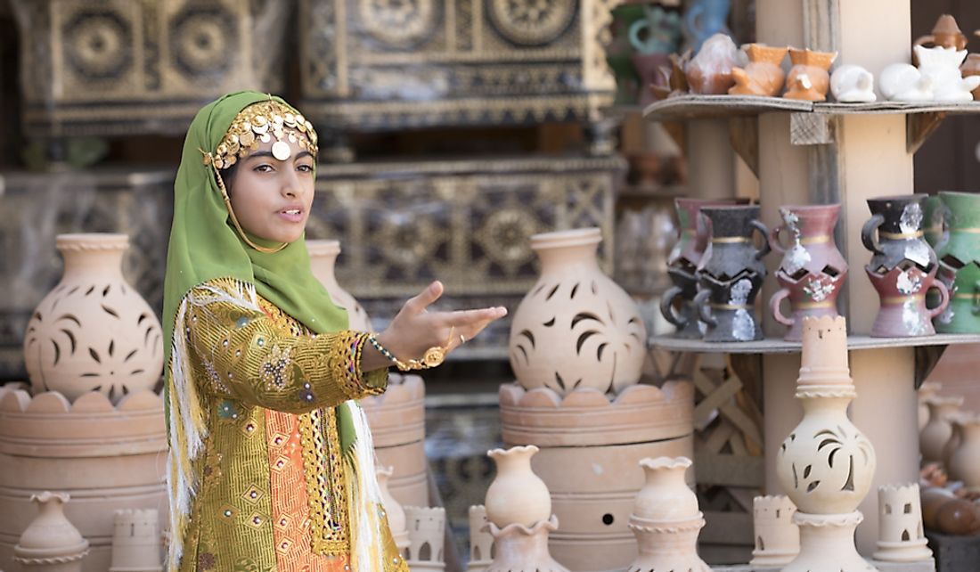 Omani girl dressed in traditional clothing in Nizwa, Oman. Editorial credit: Katiekk / Shutterstock.com