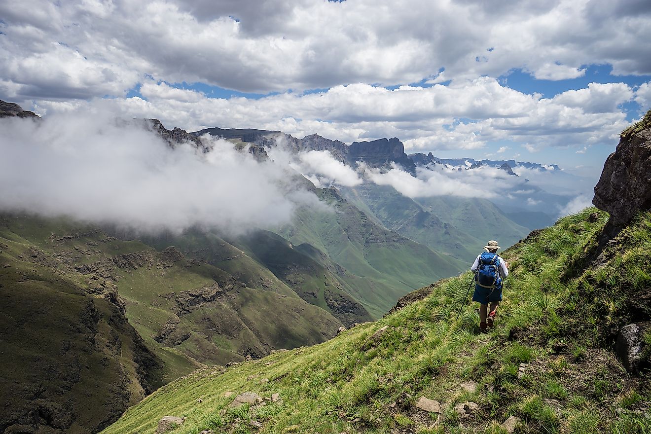 Hiker enjoying view from high up in Drakensberg mountains.