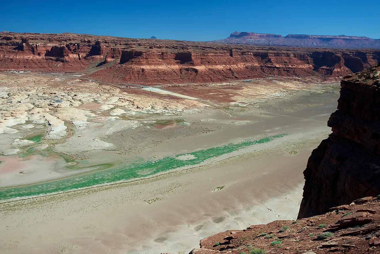 The Colorado River and the dried up arm of Lake Powell at Hite, Utah