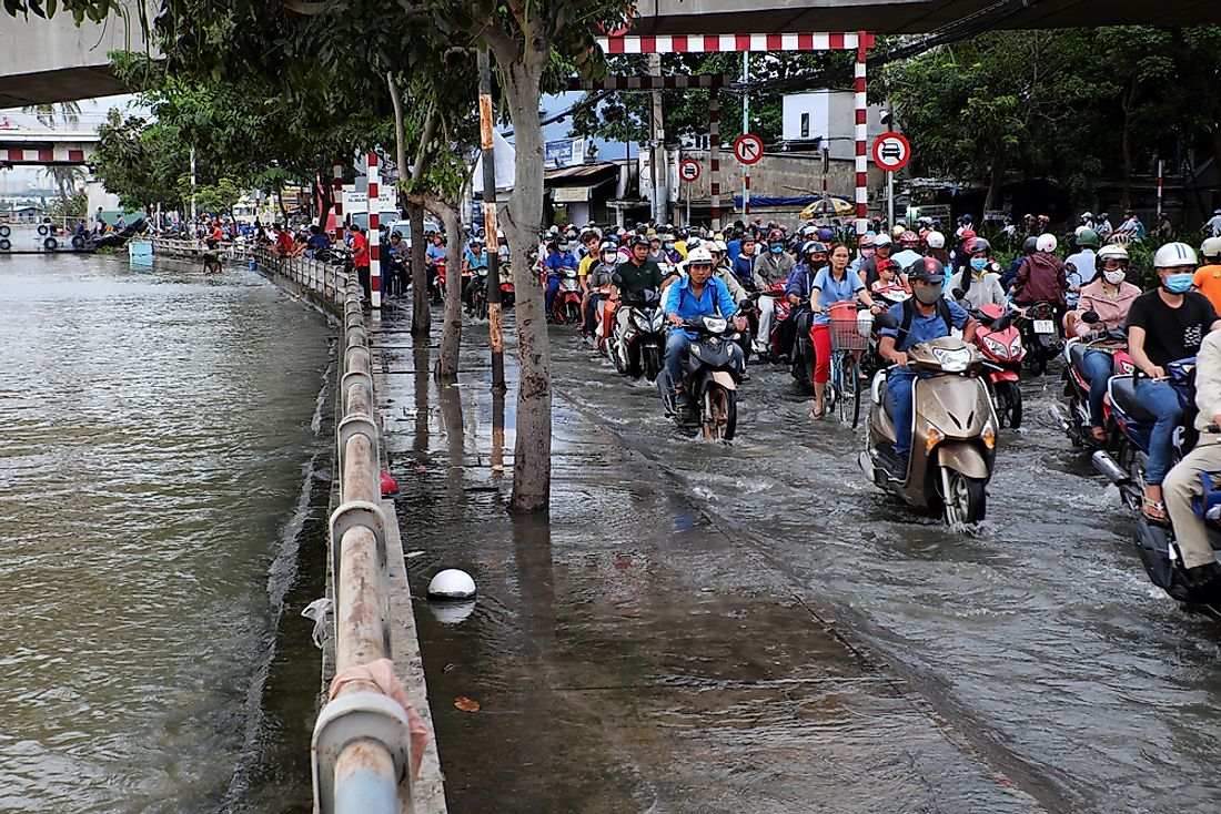 Editorial credit: xuanhuongho / Shutterstock.com. Flooded streets in Ho Chi Minh City, Vietnam. 