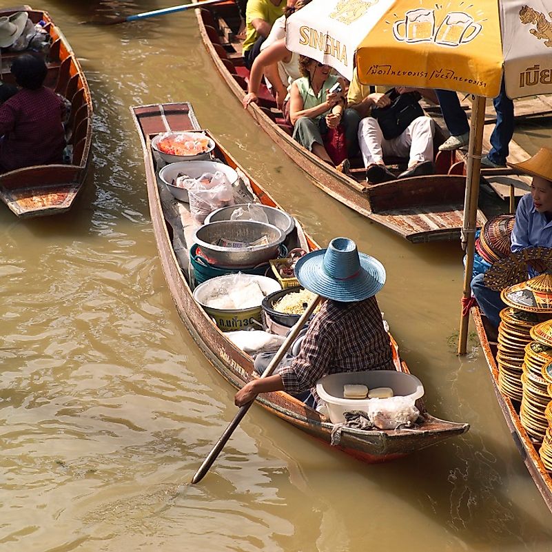 This vendor sell his wares directly from his small boat in this "floating market" in Bangkok, Thailand.