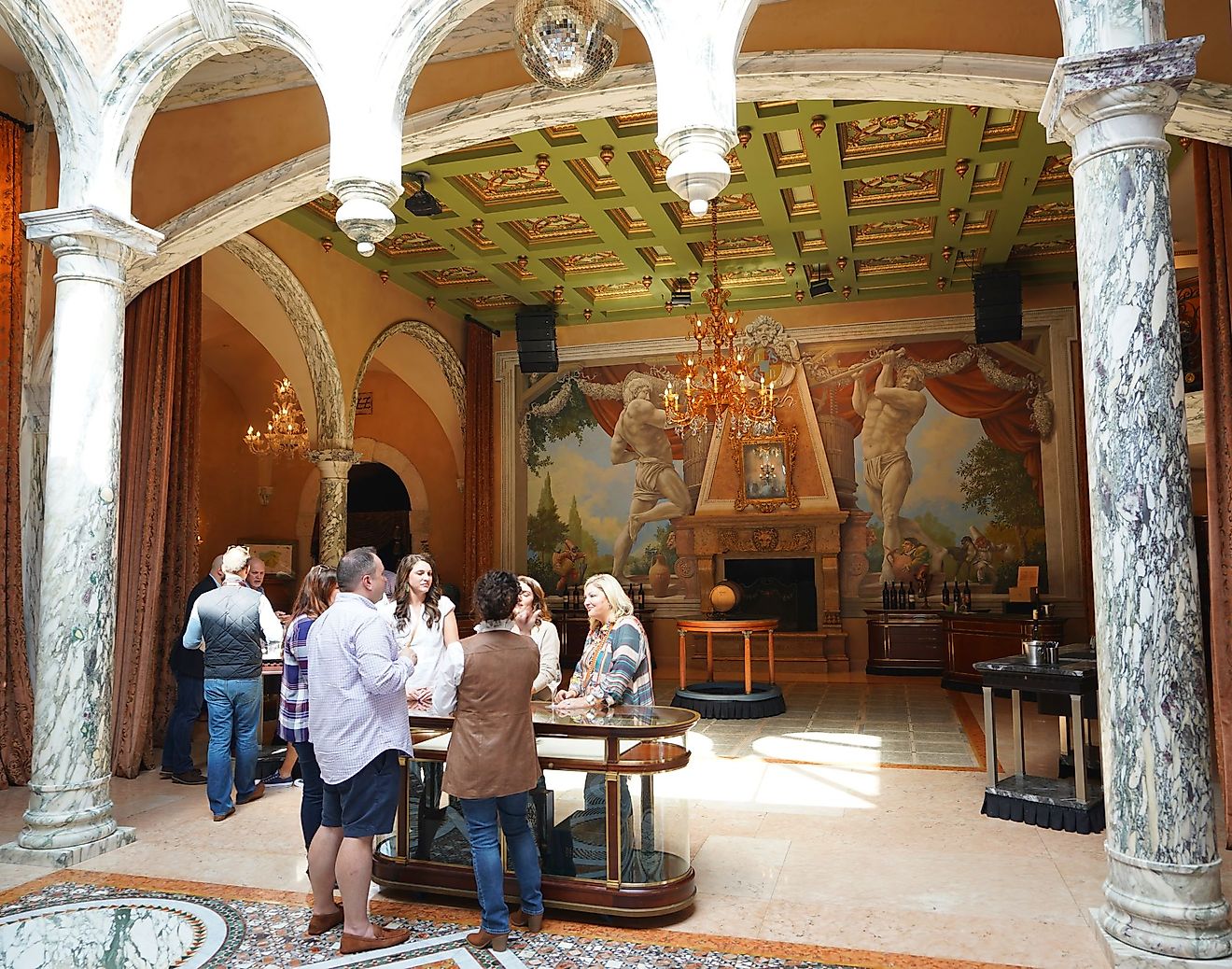 Wine enthusiasts taste wine at the Del Dotto Estate Winery & Caves, in Napa Valley, St. Helena, California. Editorial credit: Leonard Zhukovsky / Shutterstock.com