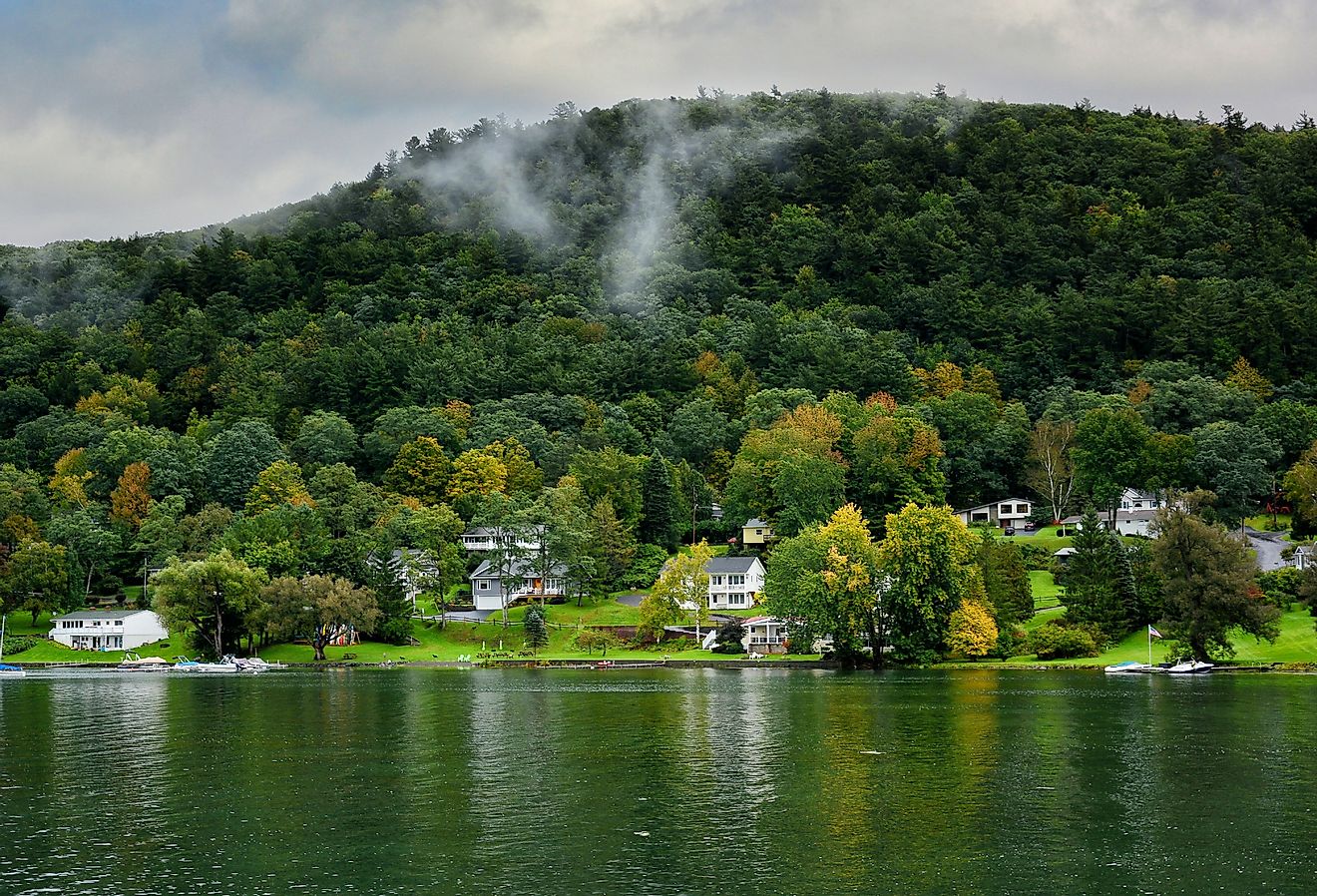 Homes along the shore of Ostego Lake, the source of the Susquehanna River in Cooperstown, New York. Image credit Steve Cukrov via Shutterstock