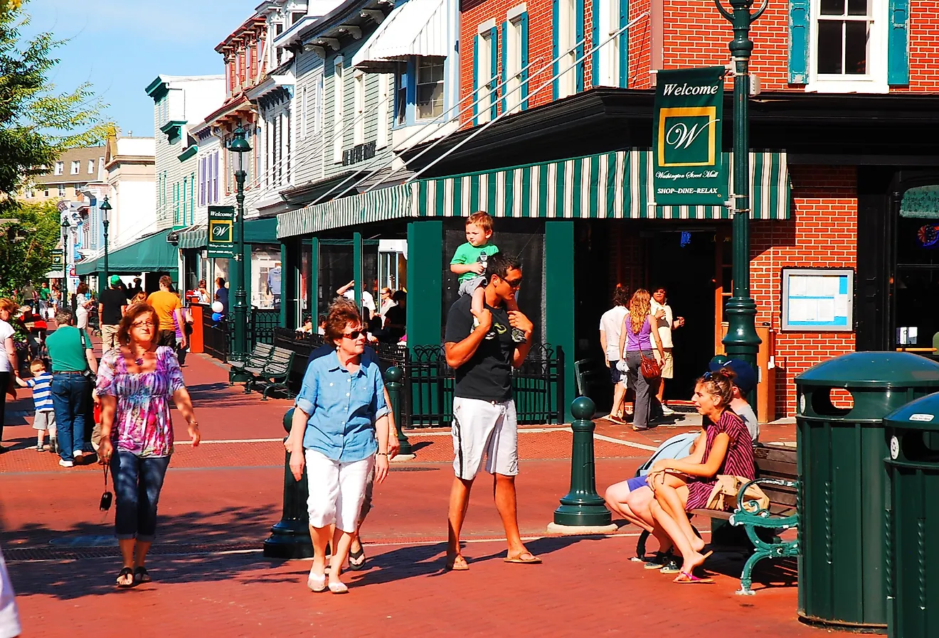 People walk around Washington Street Mall and shopping area in Cape May, New Jersey. Image credit James Kirkikis via Shutterstock