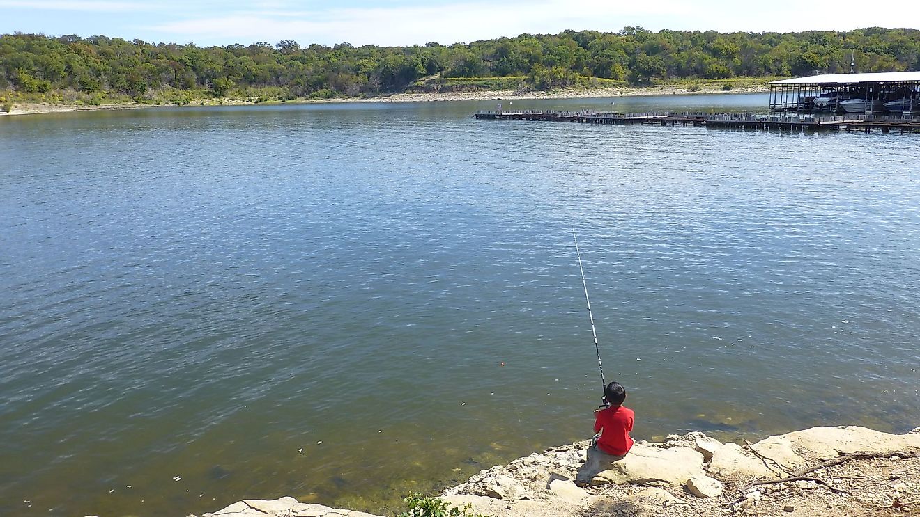 Boy fishing in Lake Texoma at Eisenhower State Park in Texas