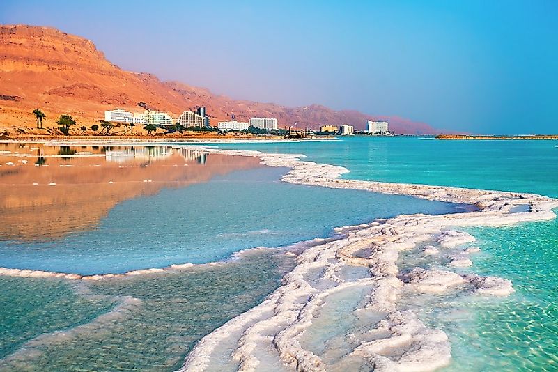 Salt accumulates along the shores of the Israeli resort district of Ein Bokek. Ein Bokek is on the coast of the Dead Sea, the lowest place on Earth.