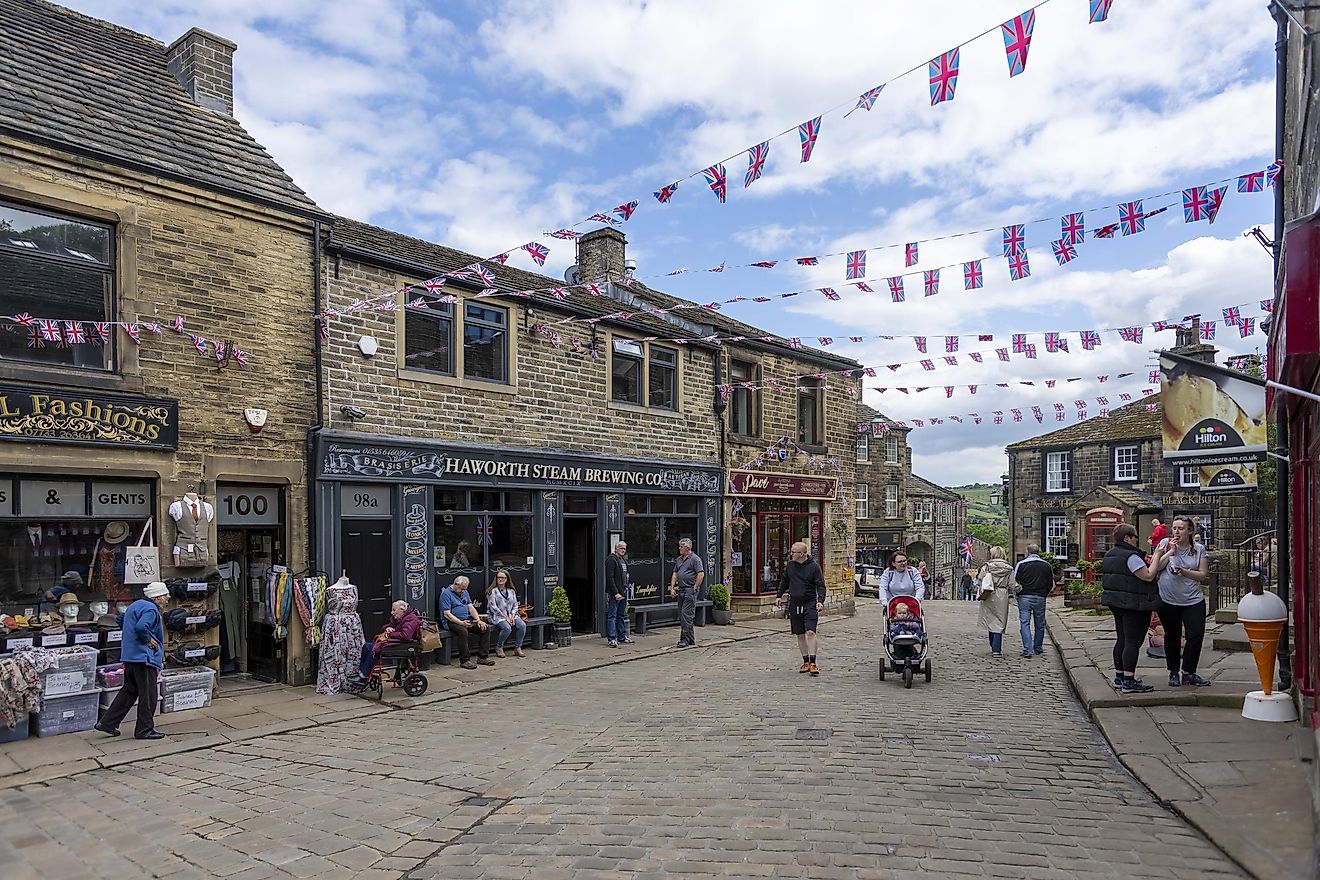 This is historic Haworth, Yorkshire, England, UK, home of the Bronte sisters. The village is bedecked in bunting and union flags as it celebrates the Platinum Jubilee of Queen Elizabeth II.