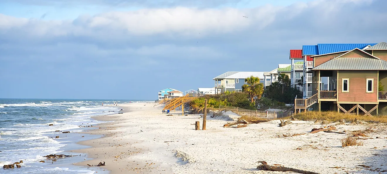 Siesta Key Beach in Sarasota, Florida, on a beautiful sunny day during spring break, with bright blue water, boats, and white sands.